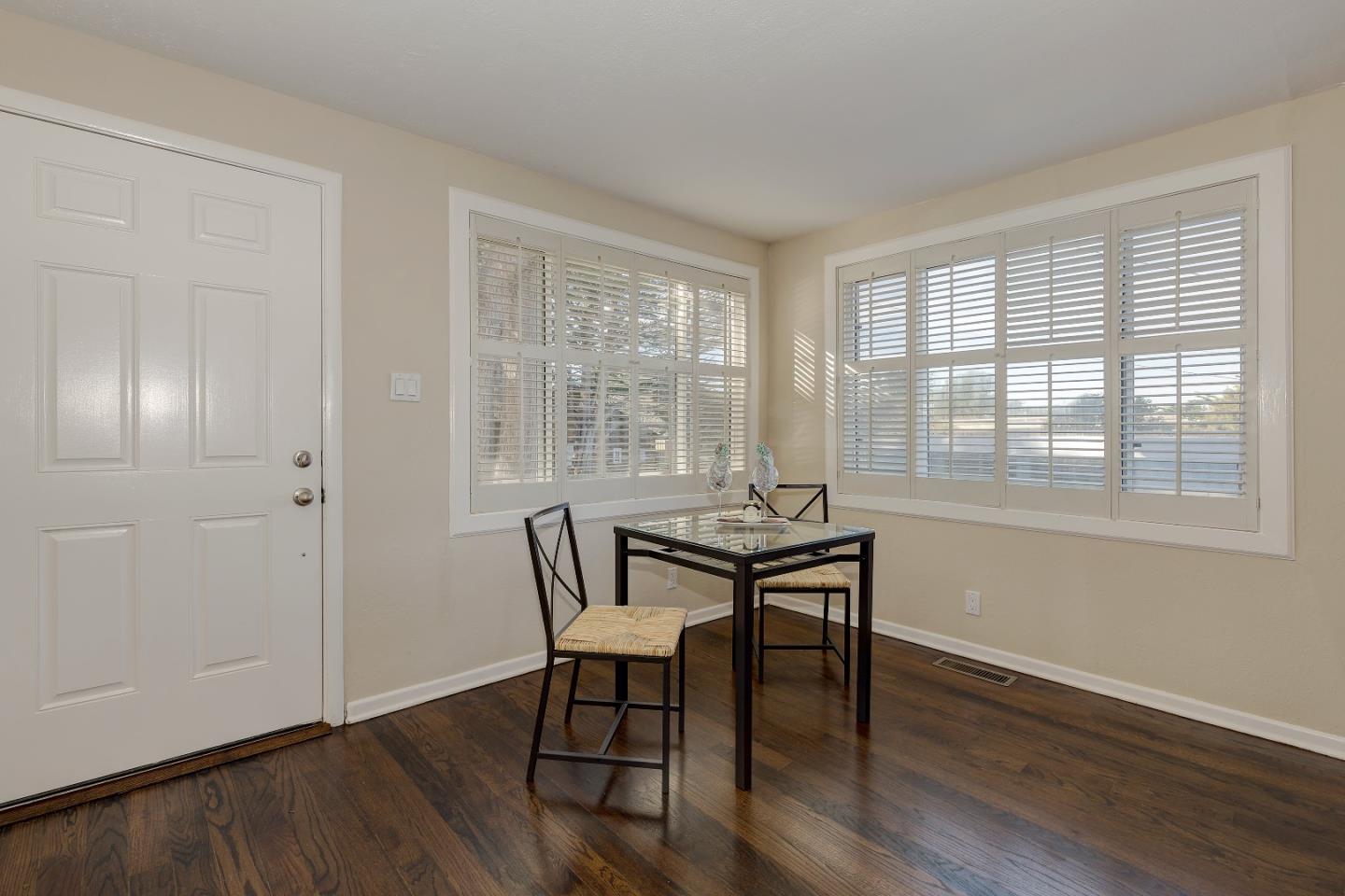 263 Clarendon Road Pacifica, CA 94044 - Photo 6 of 36 a dining room with wooden floor and a window