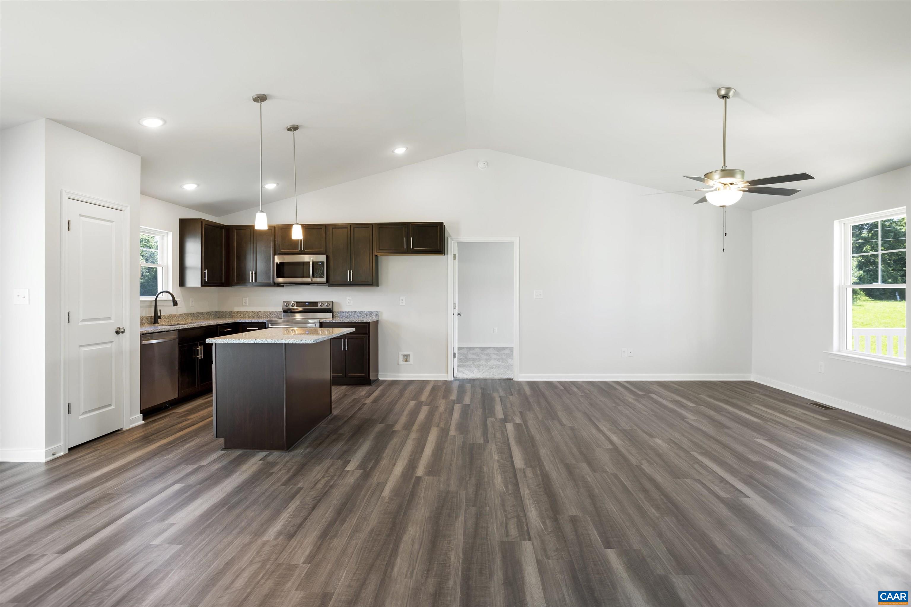 Lot 3 New Line Road Mineral, VA 23117 - Photo 9 of 18 a large kitchen with stainless steel appliances a large counter top a sink a refrigerator and a window