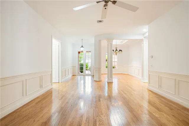 a view of an entryway of a house and wooden floor