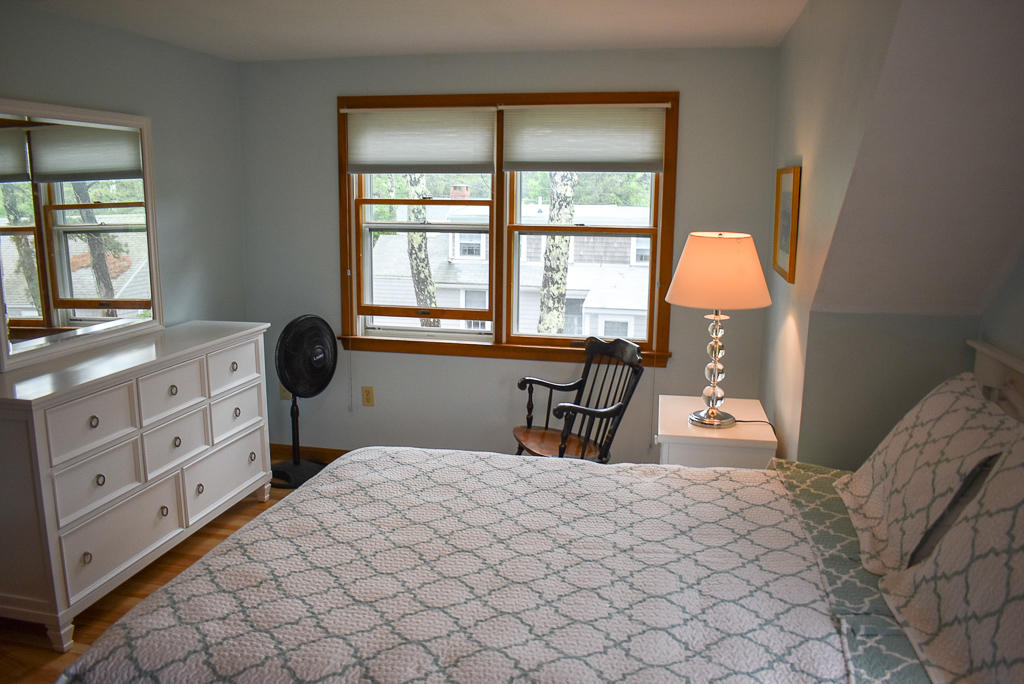 61 Bain Road Dennis Port, MA 02639 - Photo 13 of 22 a bedroom with furniture and a window