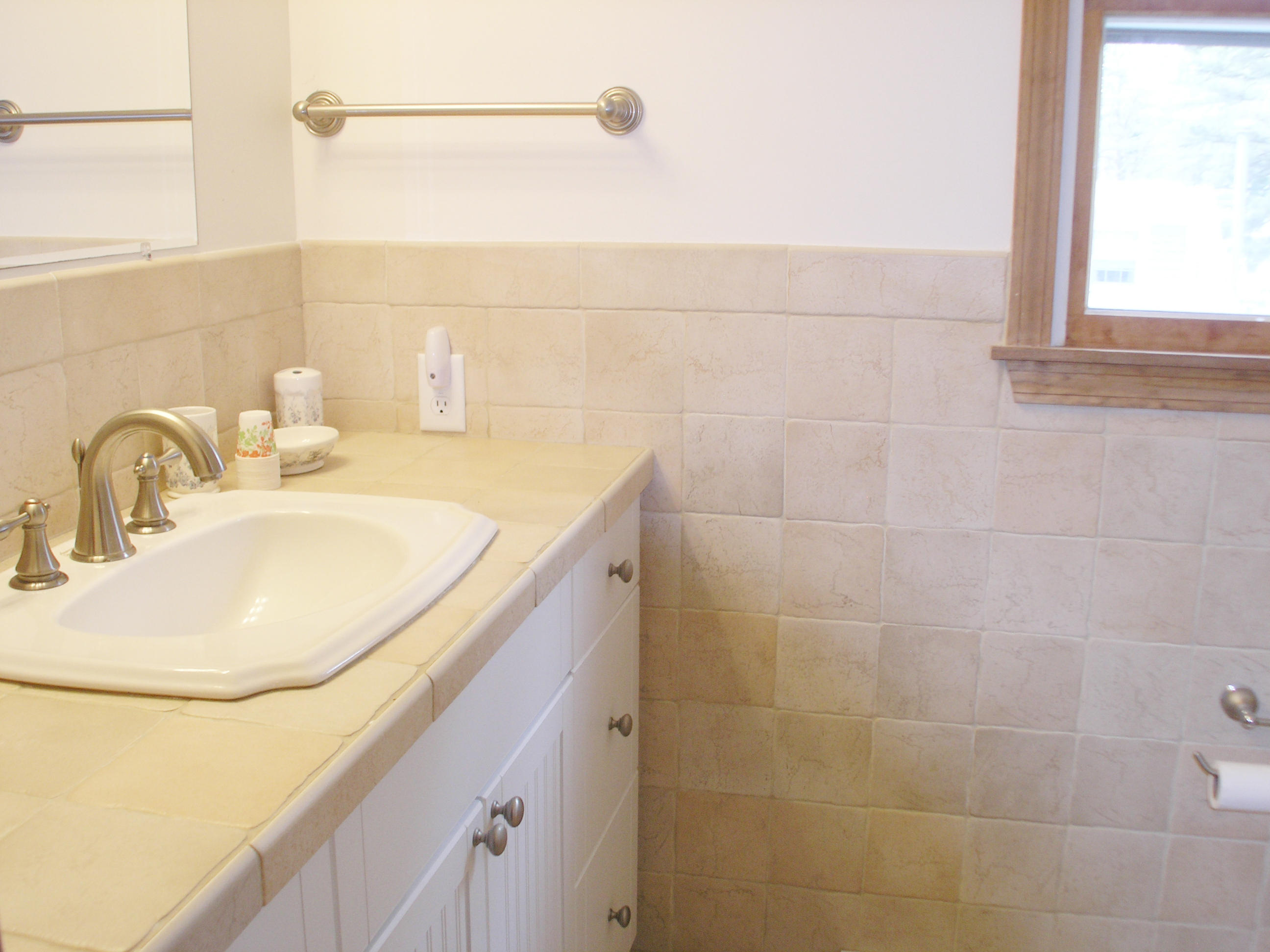 61 Bain Road Dennis Port, MA 02639 - Photo 17 of 22 a bathroom with a sink and a mirror