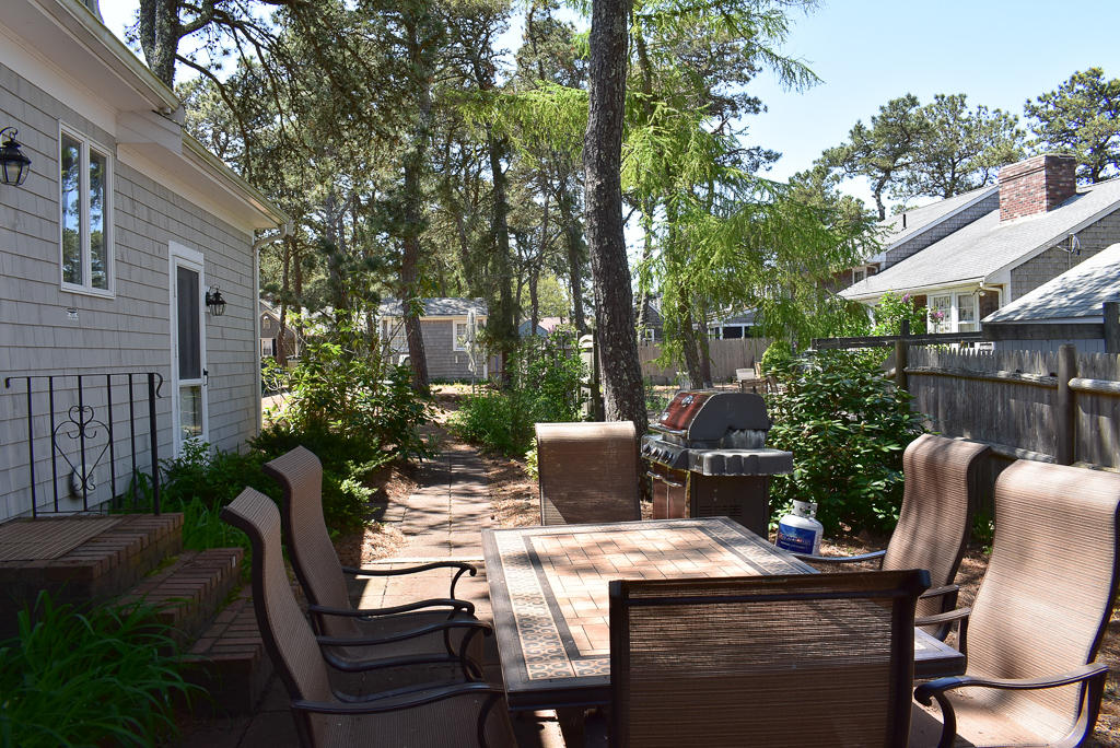 61 Bain Road Dennis Port, MA 02639 - Photo 19 of 22 a view of an outdoor sitting area with furniture