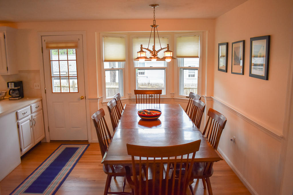 61 Bain Road Dennis Port, MA 02639 - Photo 5 of 22 a view of a dining room with furniture window and wooden floor