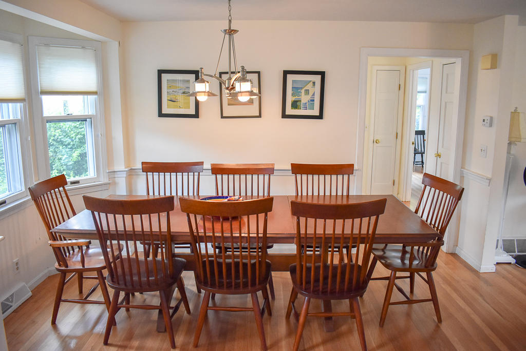 61 Bain Road Dennis Port, MA 02639 - Photo 7 of 22 a view of a dining room with furniture window and wooden floor