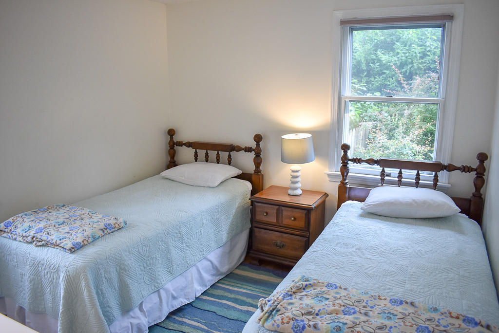 61 Bain Road Dennis Port, MA 02639 - Photo 8 of 22 a bedroom with a bed and a large window