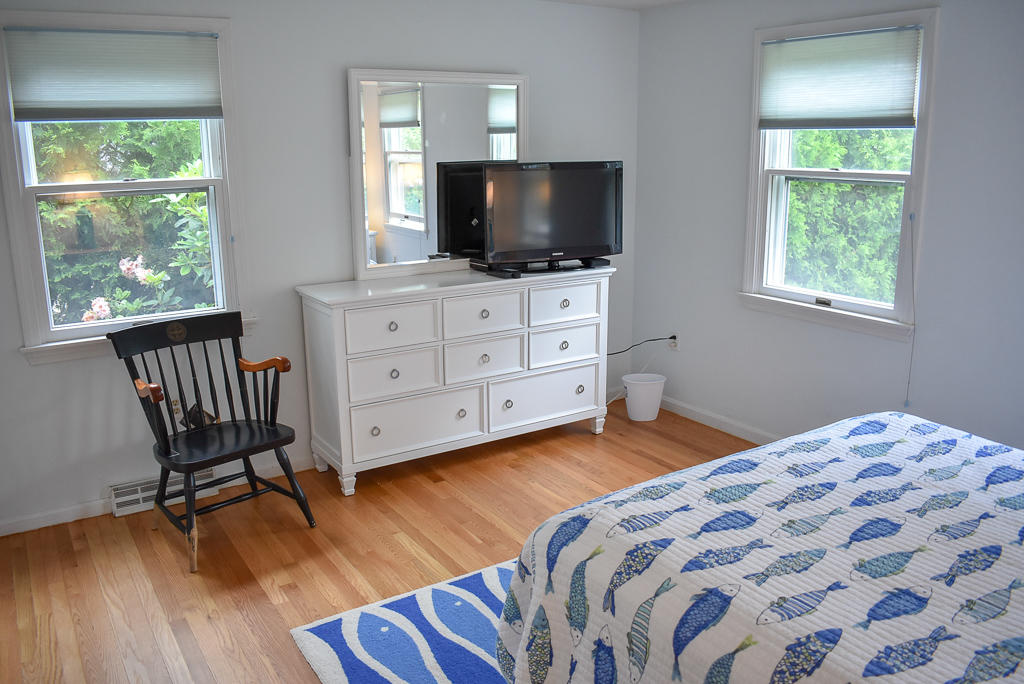61 Bain Road Dennis Port, MA 02639 - Photo 10 of 22 a bedroom with a bed and a flat screen tv