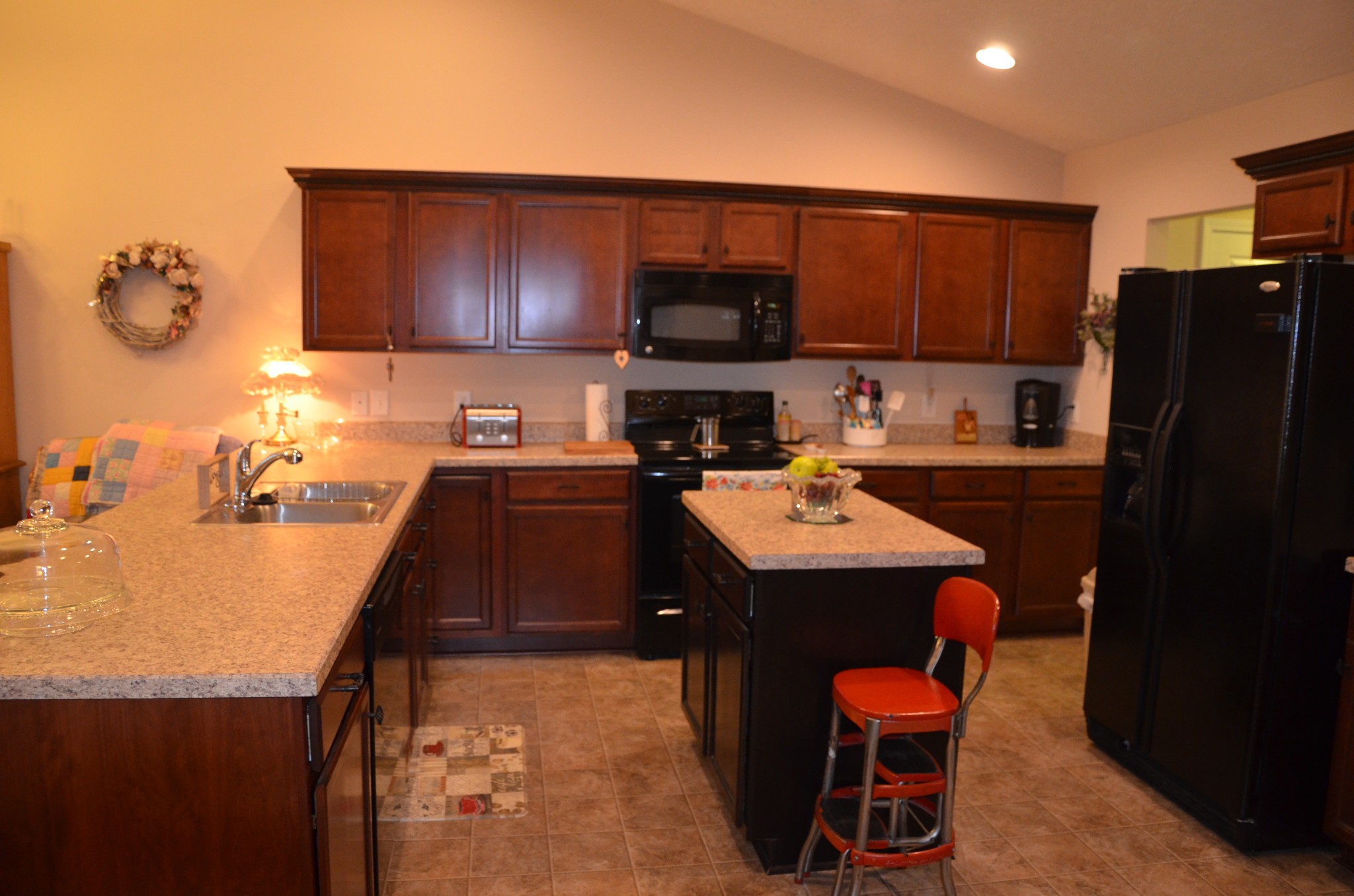 167 Speedwell Lane Lebanon, TN 37087 - Photo 4 of 21 a kitchen with a sink a stove and chairs
