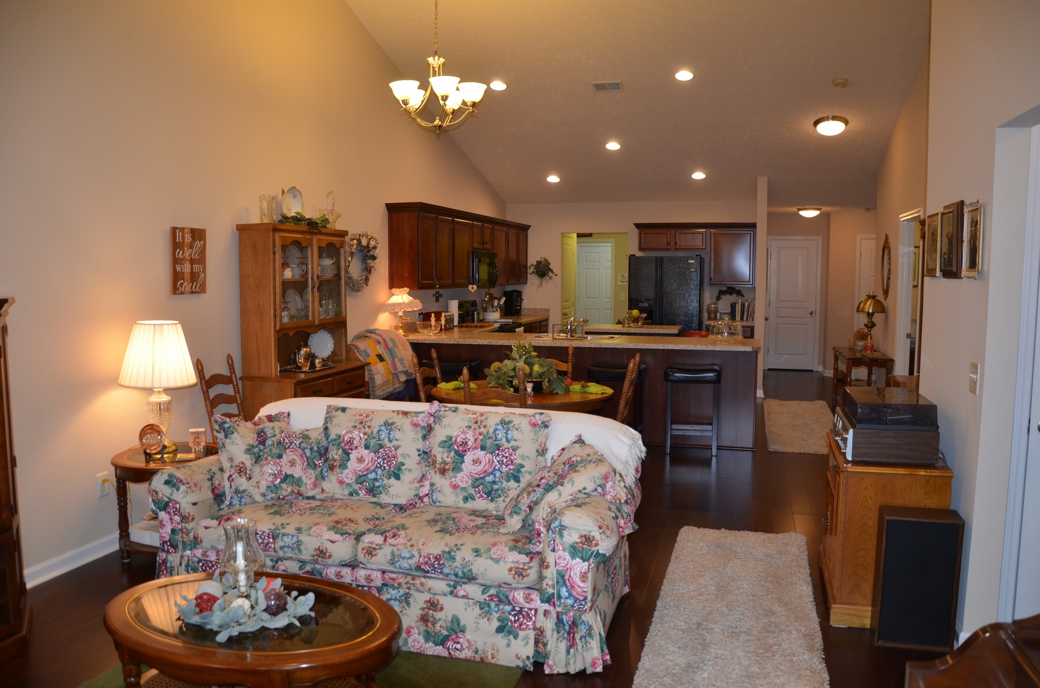 167 Speedwell Lane Lebanon, TN 37087 - Photo 10 of 21 a living room with furniture a chandelier and a fireplace