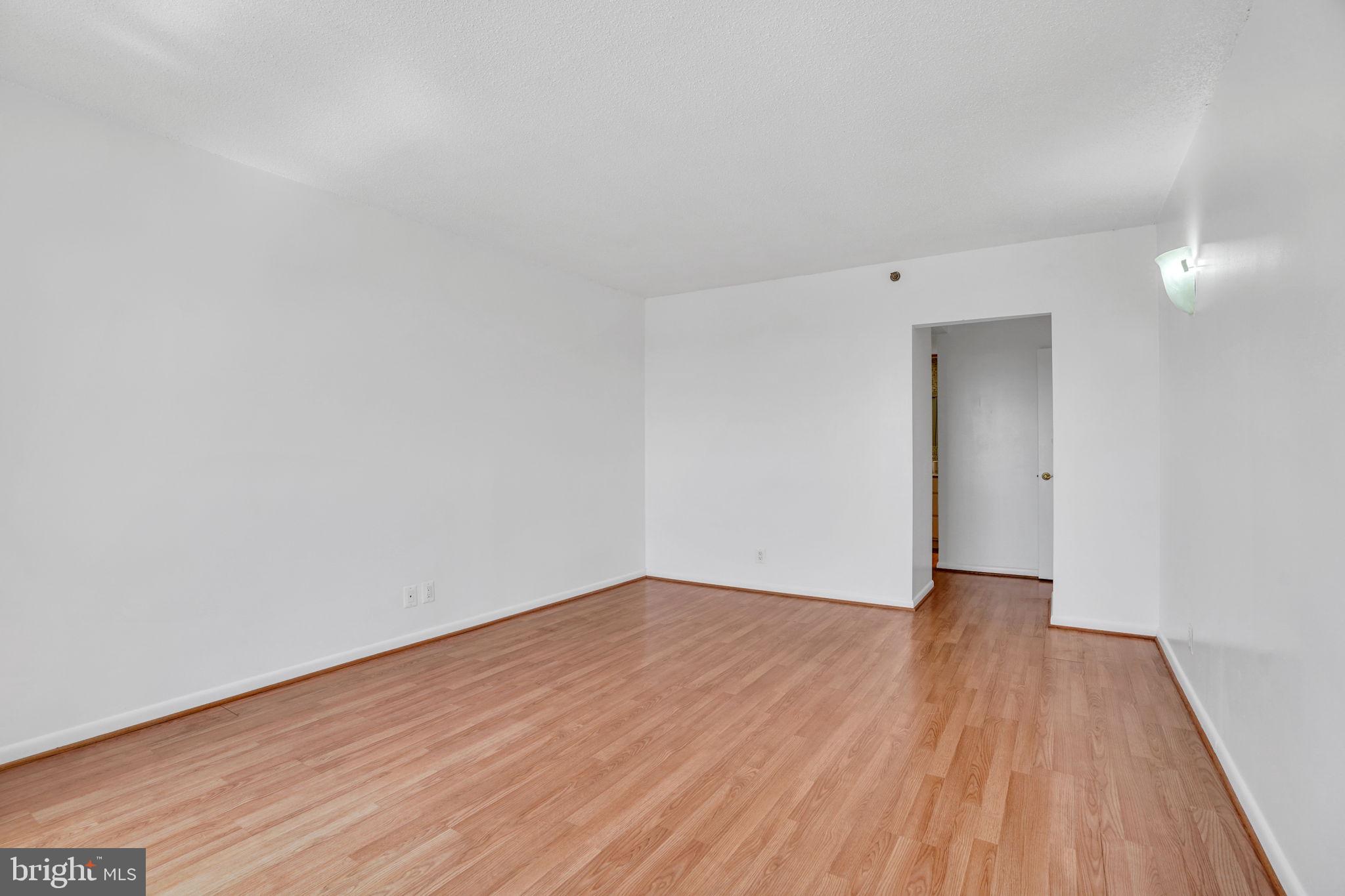 5501 Seminary Road, Unit 1908S Falls Church, VA 22041 - Photo 37 of 43 a view of an empty room with wooden floor