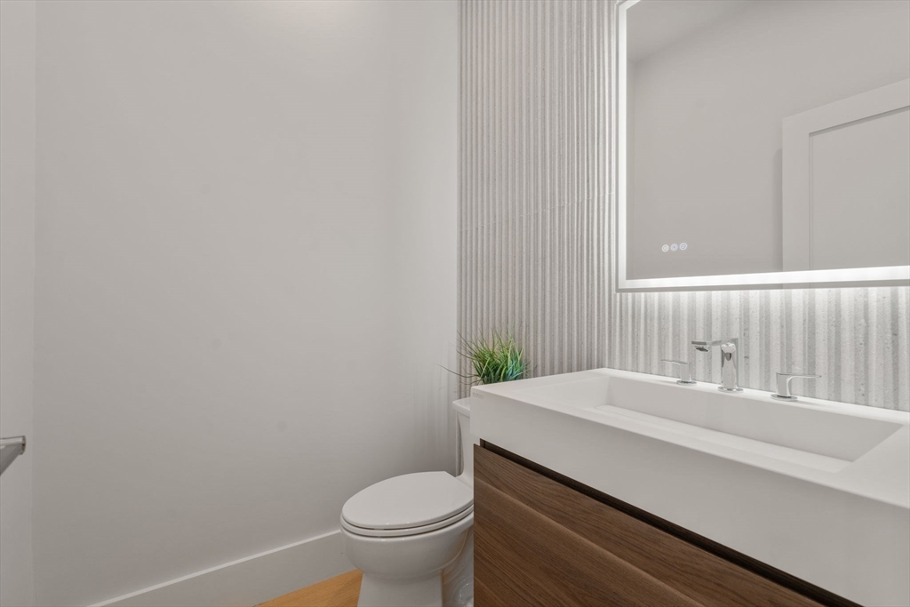 2202 Commonwealth Avenue, Unit 1 Newton, MA 02466 - Photo 15 of 34 a bathroom with a sink and a toilet