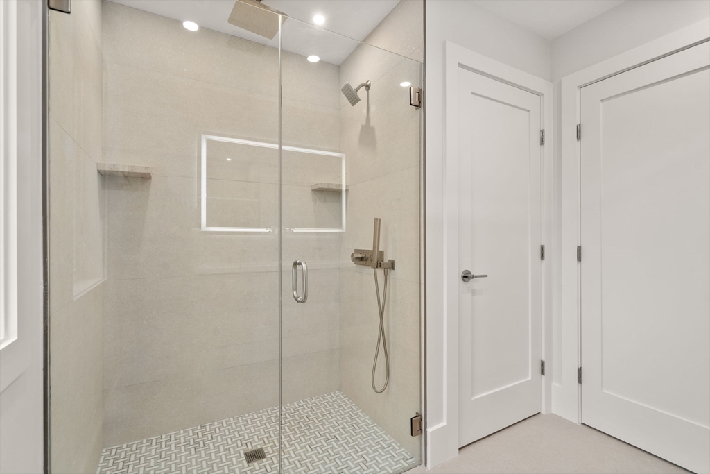 2202 Commonwealth Avenue, Unit 1 Newton, MA 02466 - Photo 21 of 34 a bathroom with a shower
