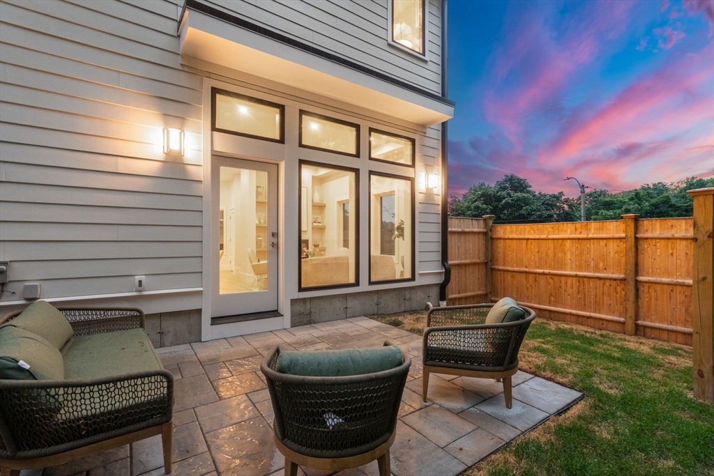 2202 Commonwealth Avenue, Unit 1 Newton, MA 02466 - Photo 29 of 34 a backyard of a house with outdoor seating