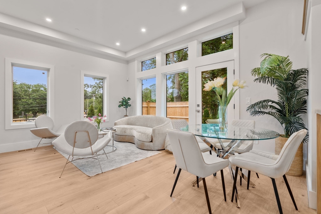 2202 Commonwealth Avenue, Unit 1 Newton, MA 02466 - Photo 3 of 34 a living room with furniture and a large window