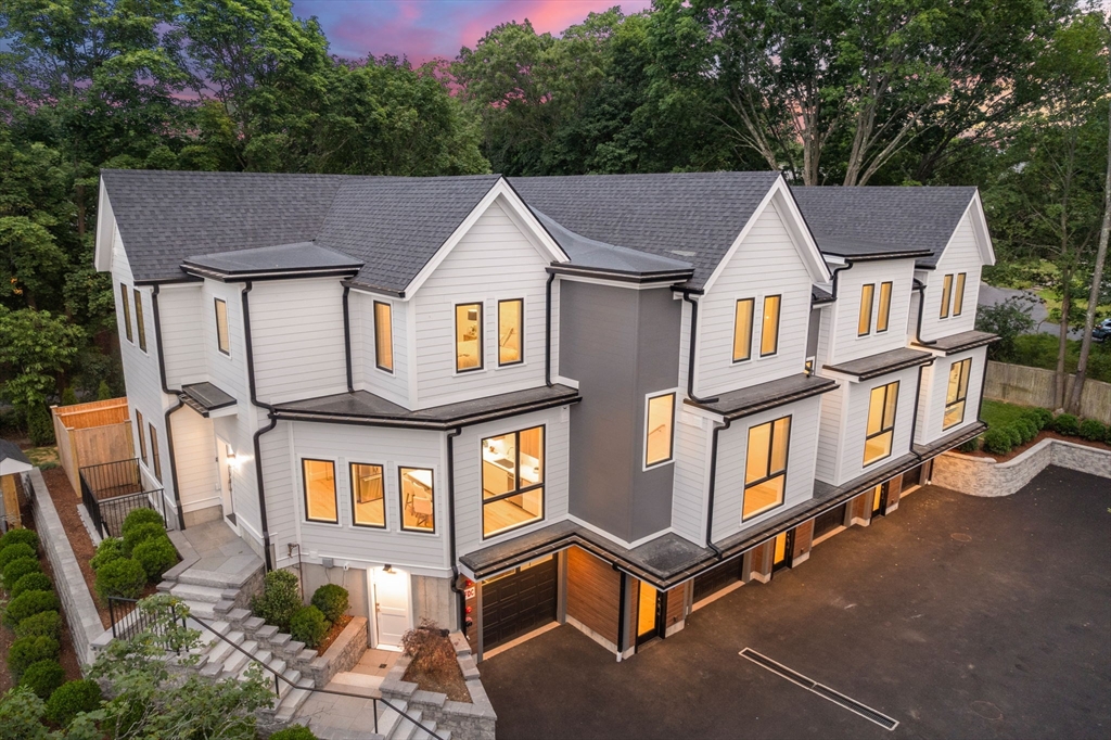 2202 Commonwealth Avenue, Unit 1 Newton, MA 02466 - Photo 32 of 34 an aerial view of a house with swimming pool and glass windows