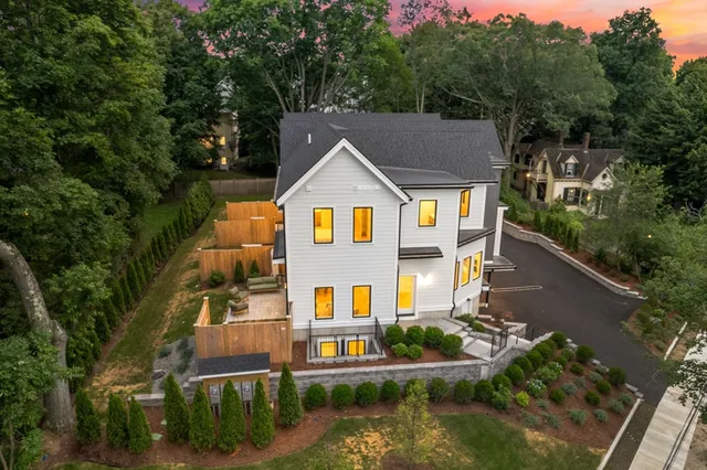 an aerial view of residential houses with yard and swimming pool