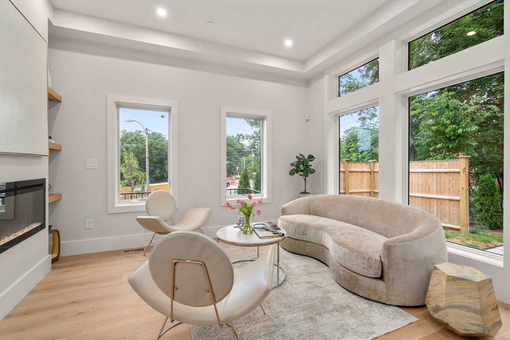 2202 Commonwealth Avenue, Unit 1 Newton, MA 02466 - Photo 6 of 34 a living room with furniture and a large window