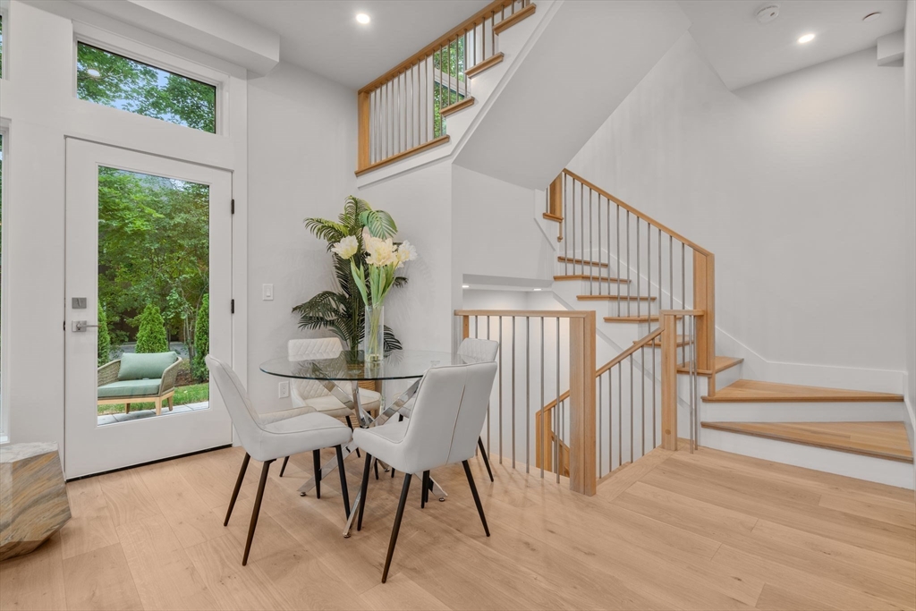 2202 Commonwealth Avenue, Unit 1 Newton, MA 02466 - Photo 8 of 34 a view of entryway and hall with wooden floor