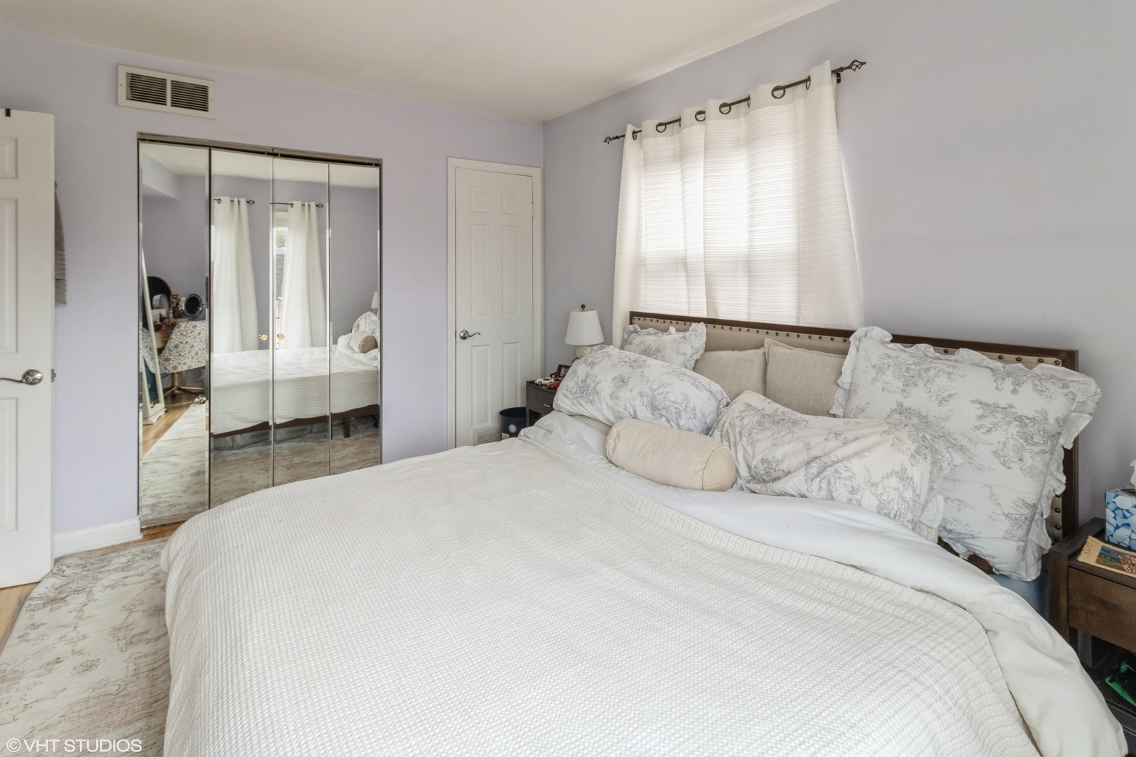3335 Kirchoff Road, Unit 4K Rolling Meadows, IL 60008 - Photo 6 of 9 a bedroom with a large bed and a window