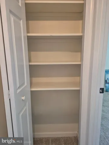 a bathroom with a sink toilet and mirror