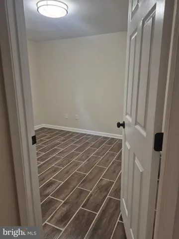a bathroom with a shower curtain and a window