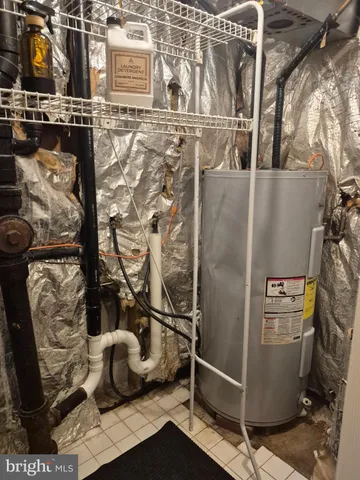 a view of storage and utility room with washer and dryer