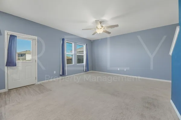 a view of an empty room with a window