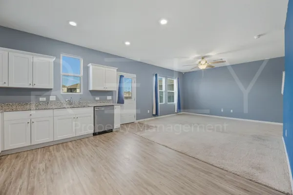 a large kitchen with cabinets