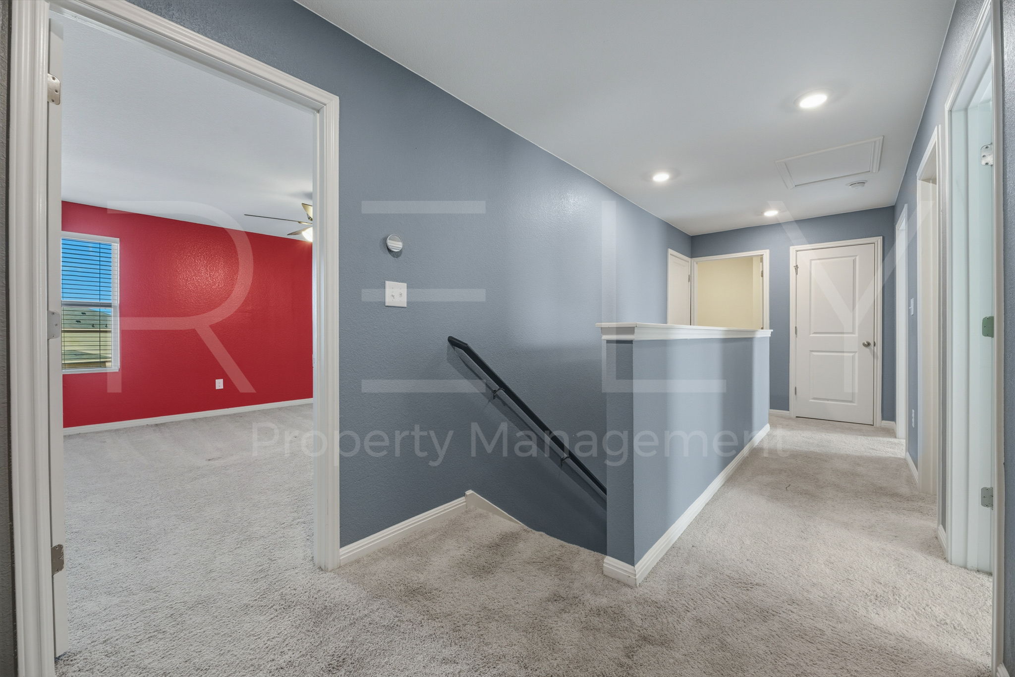 220 Wonderful Life Way Jarrell, TX 76537 - Photo 19 of 35 Hall featuring carpet flooring, an upstairs landing, and recessed lighting
