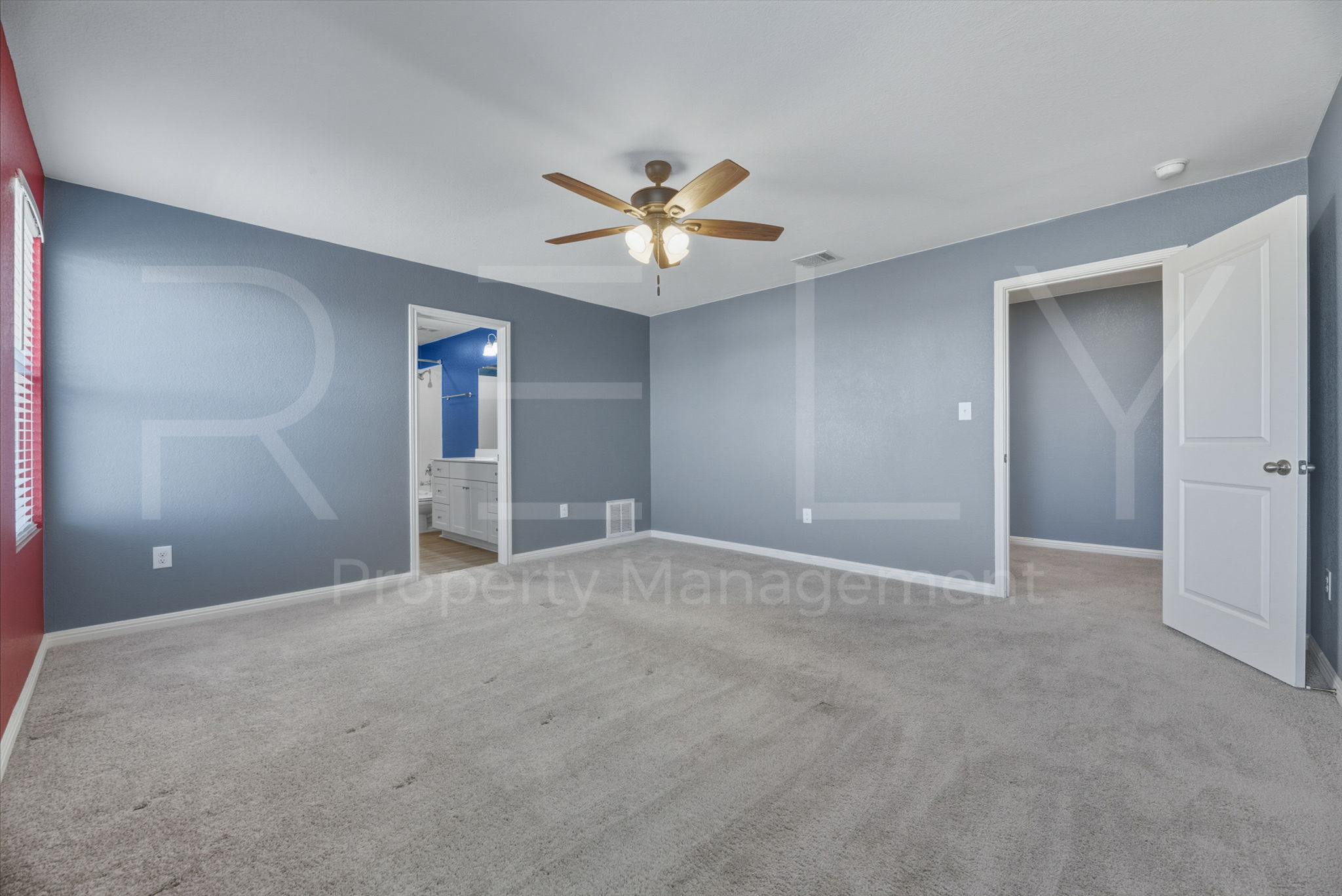 220 Wonderful Life Way Jarrell, TX 76537 - Photo 23 of 35 Unfurnished bedroom featuring connected bathroom, a ceiling fan, and light colored carpet