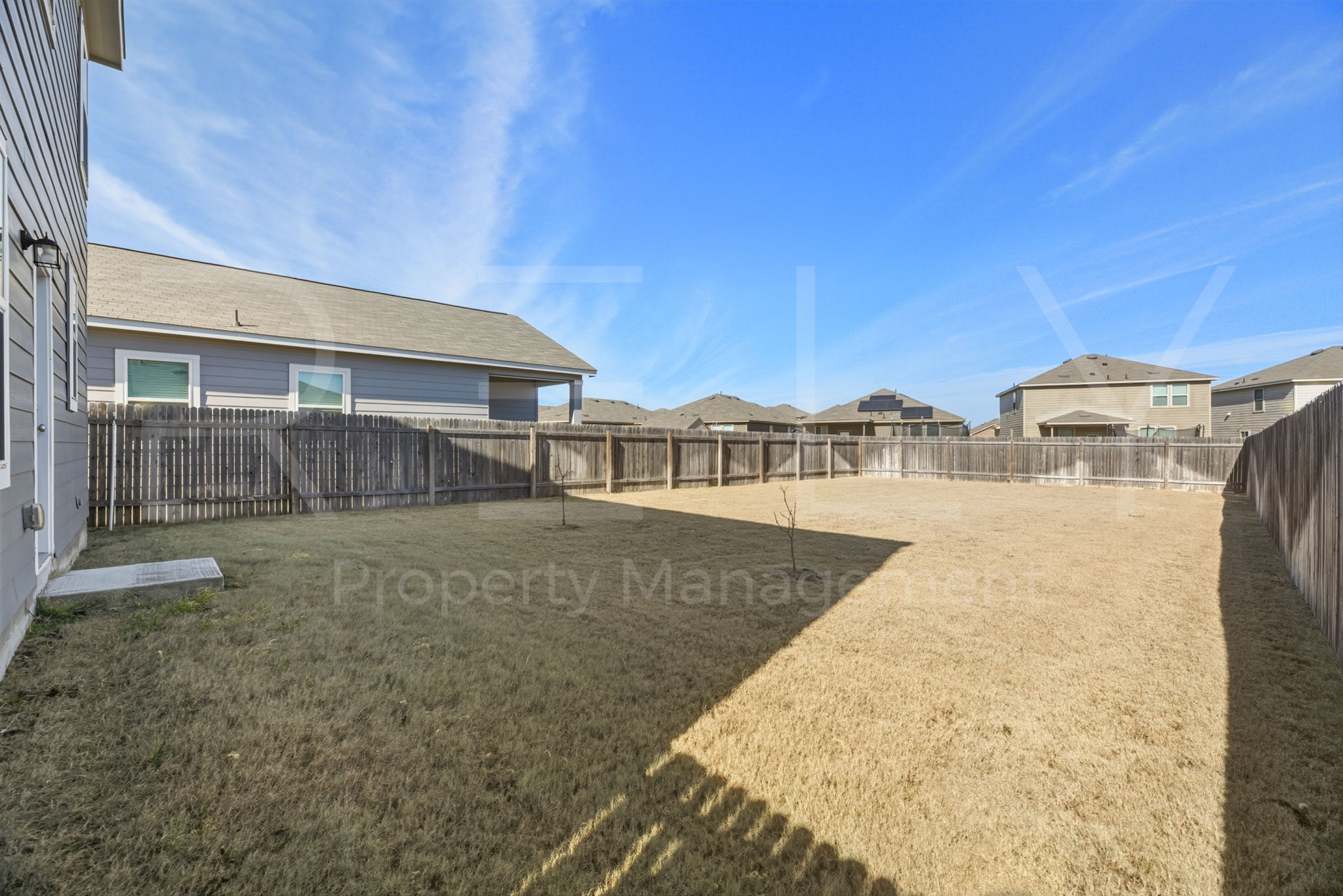 220 Wonderful Life Way Jarrell, TX 76537 - Photo 32 of 35 Fenced backyard featuring a residential view