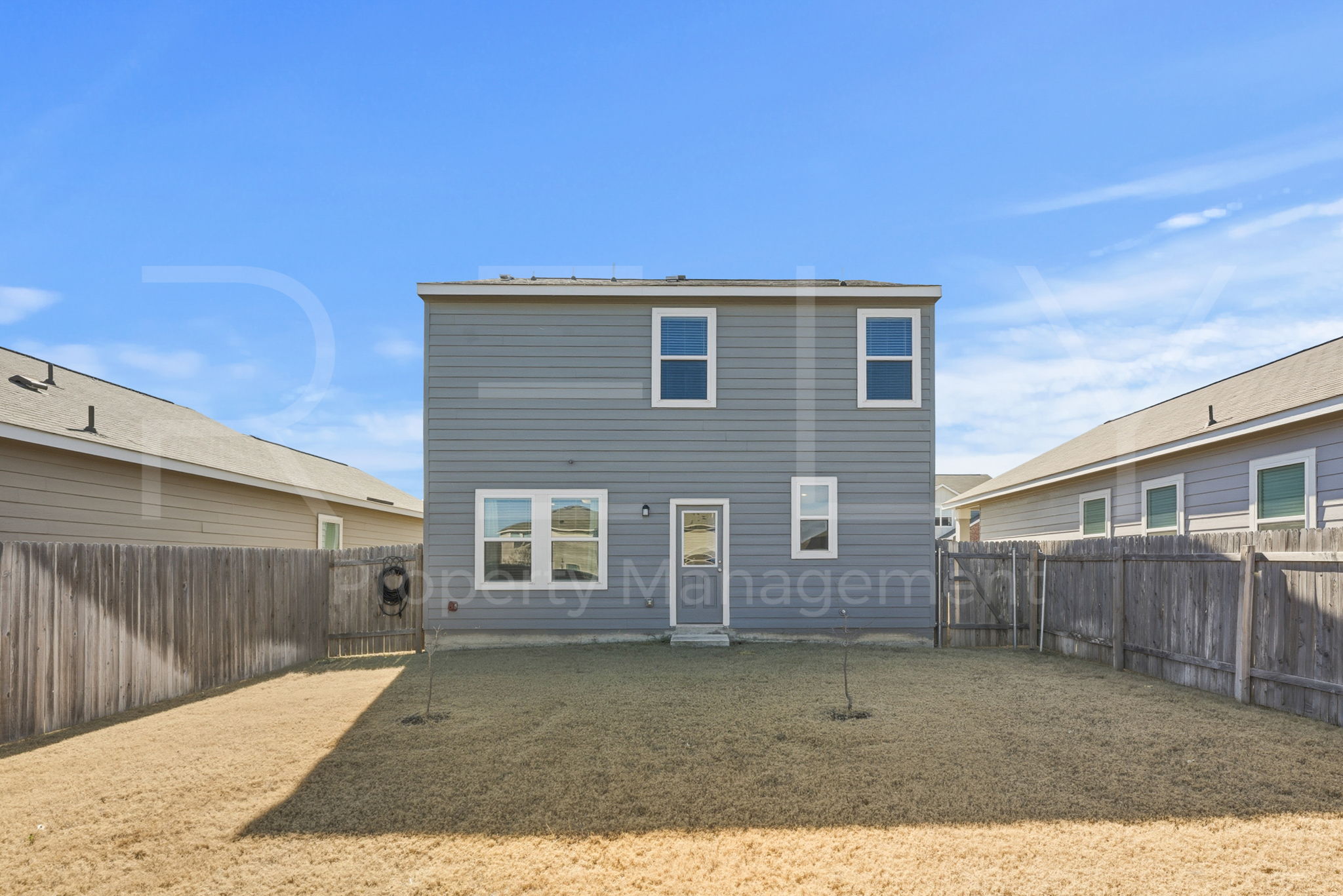 220 Wonderful Life Way Jarrell, TX 76537 - Photo 35 of 35 Back of house with a fenced backyard