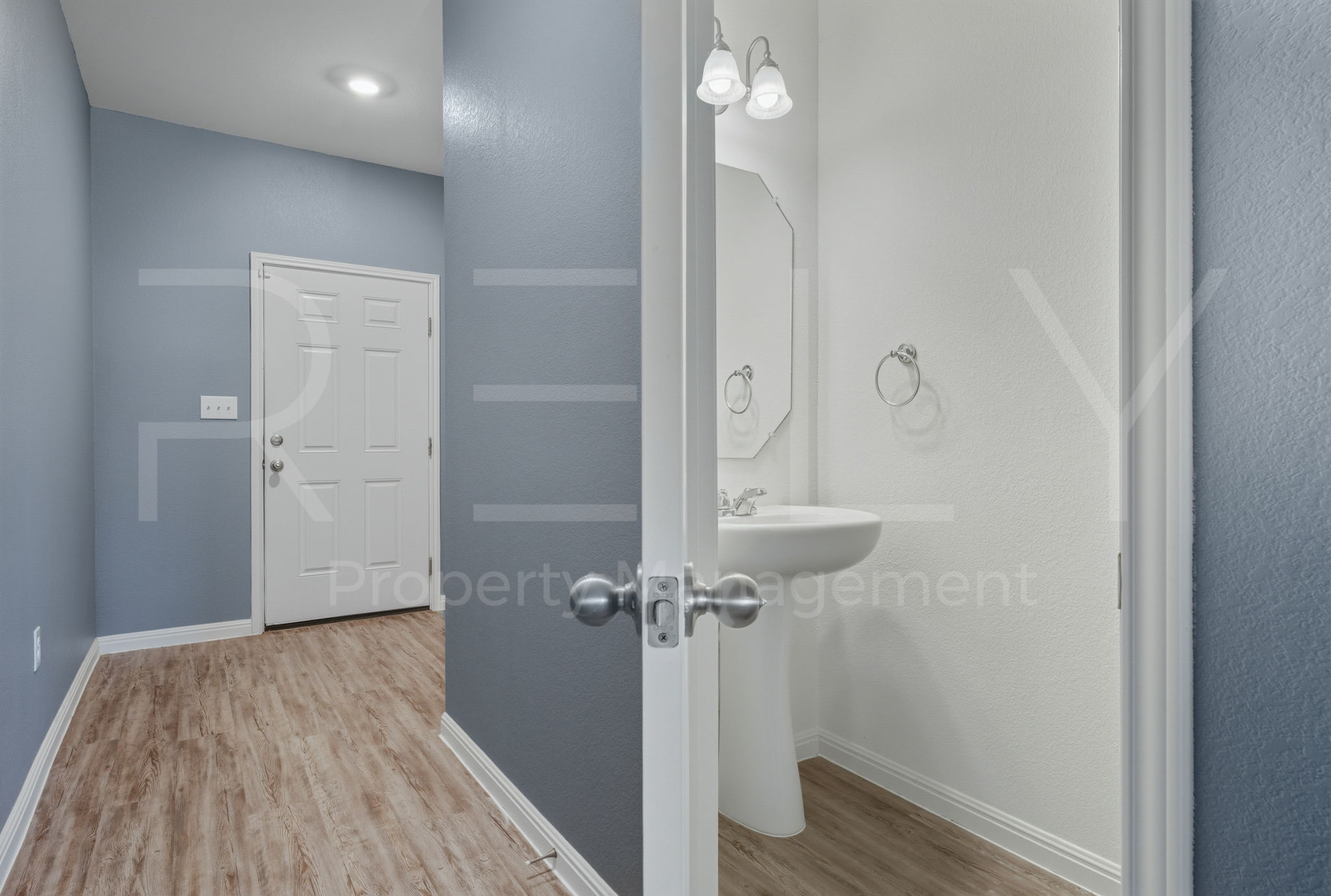 220 Wonderful Life Way Jarrell, TX 76537 - Photo 7 of 35 Half bathroom featuring light wood-style floors and baseboards