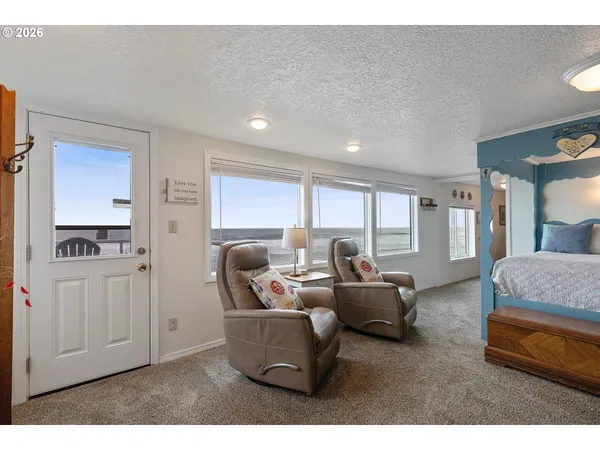 a living room with furniture and a walk in closet