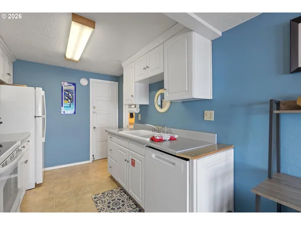 a kitchen that has a cabinets and a stove