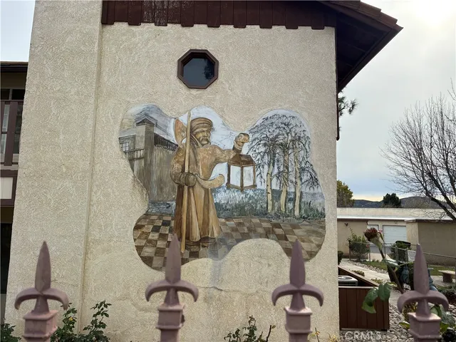 a view of a patio with table and chairs potted plants with wooden floor