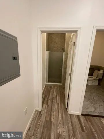 a bed room view with a chair