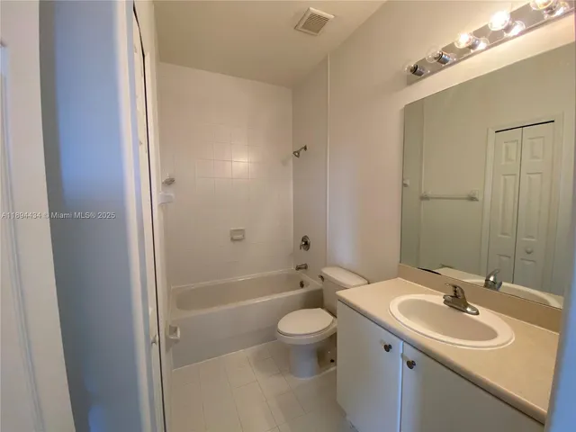 a bathroom with a sink toilet a shower and a mirror