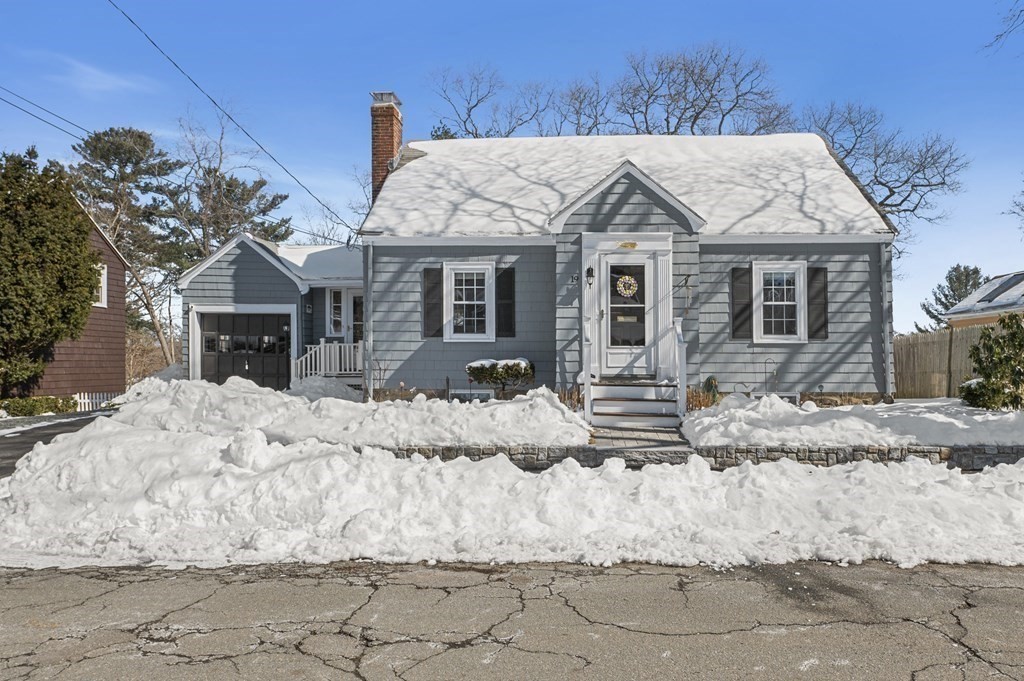 19 Walnut Road Swampscott, MA 01907 - Photo 1 of 36 a view of a white house with wooden fence next to a road