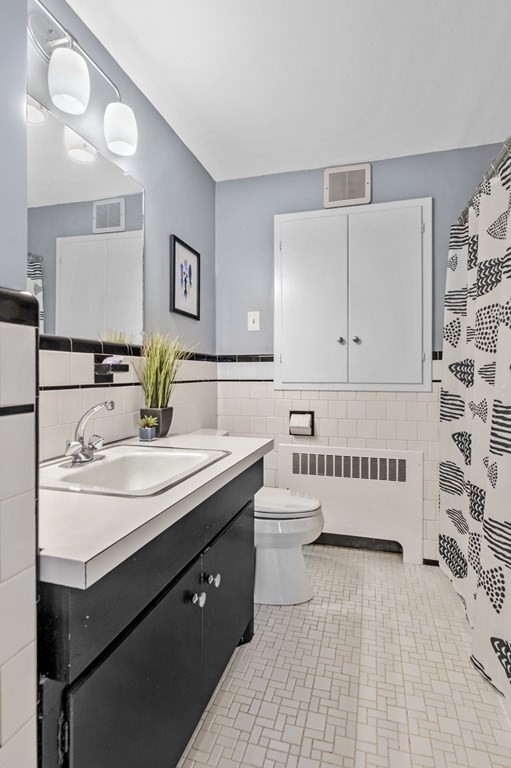 19 Walnut Road Swampscott, MA 01907 - Photo 16 of 36 a bathroom with a sink and a mirror