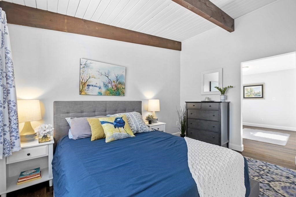 19 Walnut Road Swampscott, MA 01907 - Photo 22 of 36 a bedroom with a bed and wooden floor