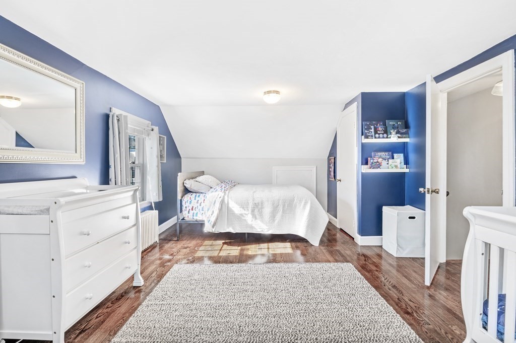 19 Walnut Road Swampscott, MA 01907 - Photo 23 of 36 a bedroom with a bed and a large mirror on dresser