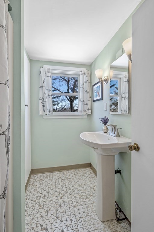 19 Walnut Road Swampscott, MA 01907 - Photo 25 of 36 a bathroom with a sink a toilet and mirror