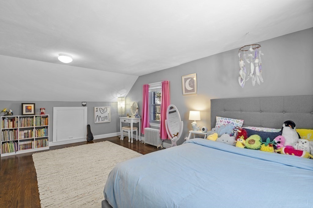 19 Walnut Road Swampscott, MA 01907 - Photo 27 of 36 a bed room with a bed and a book shelf