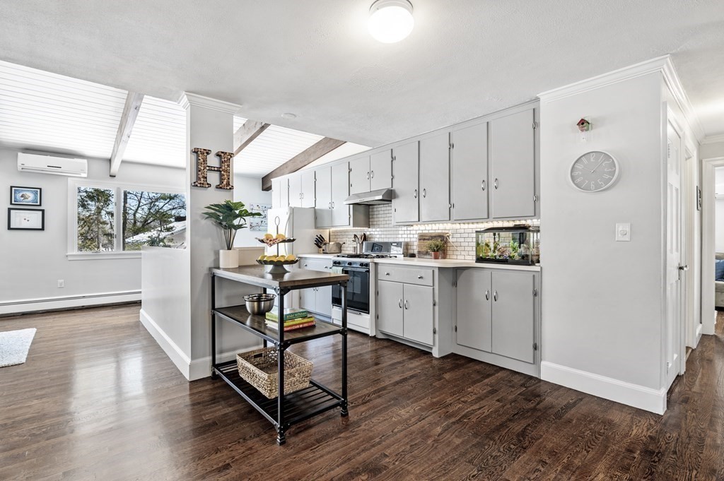 19 Walnut Road Swampscott, MA 01907 - Photo 8 of 36 a kitchen with a table chairs refrigerator and cabinets