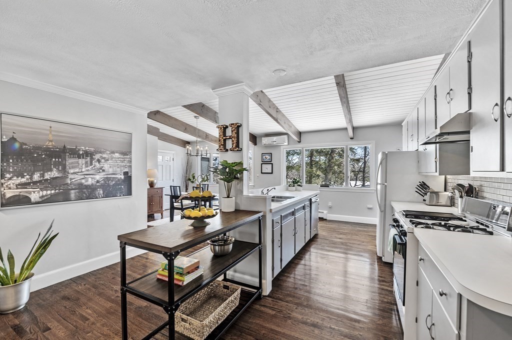 19 Walnut Road Swampscott, MA 01907 - Photo 10 of 36 a kitchen with stainless steel appliances a stove a sink dishwasher and cabinets with wooden floor