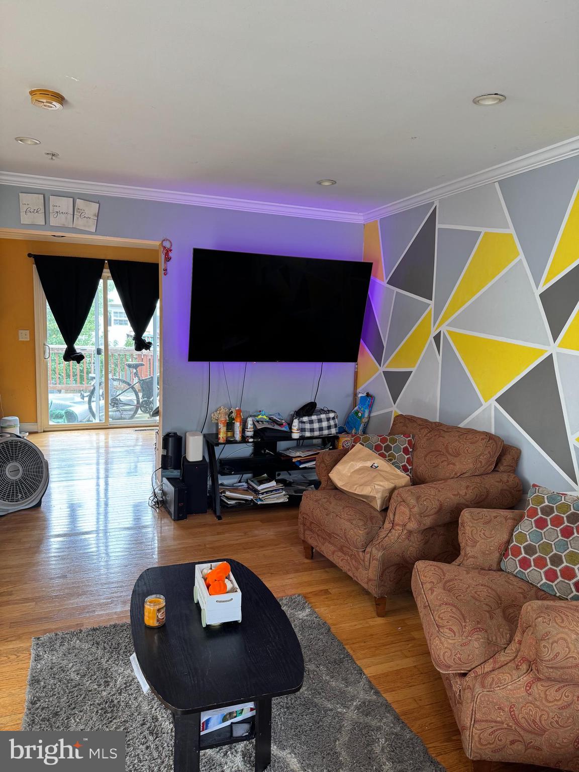 3510 Community Drive District Heights, MD 20747 - Photo 3 of 6 a living room with furniture and a flat screen tv