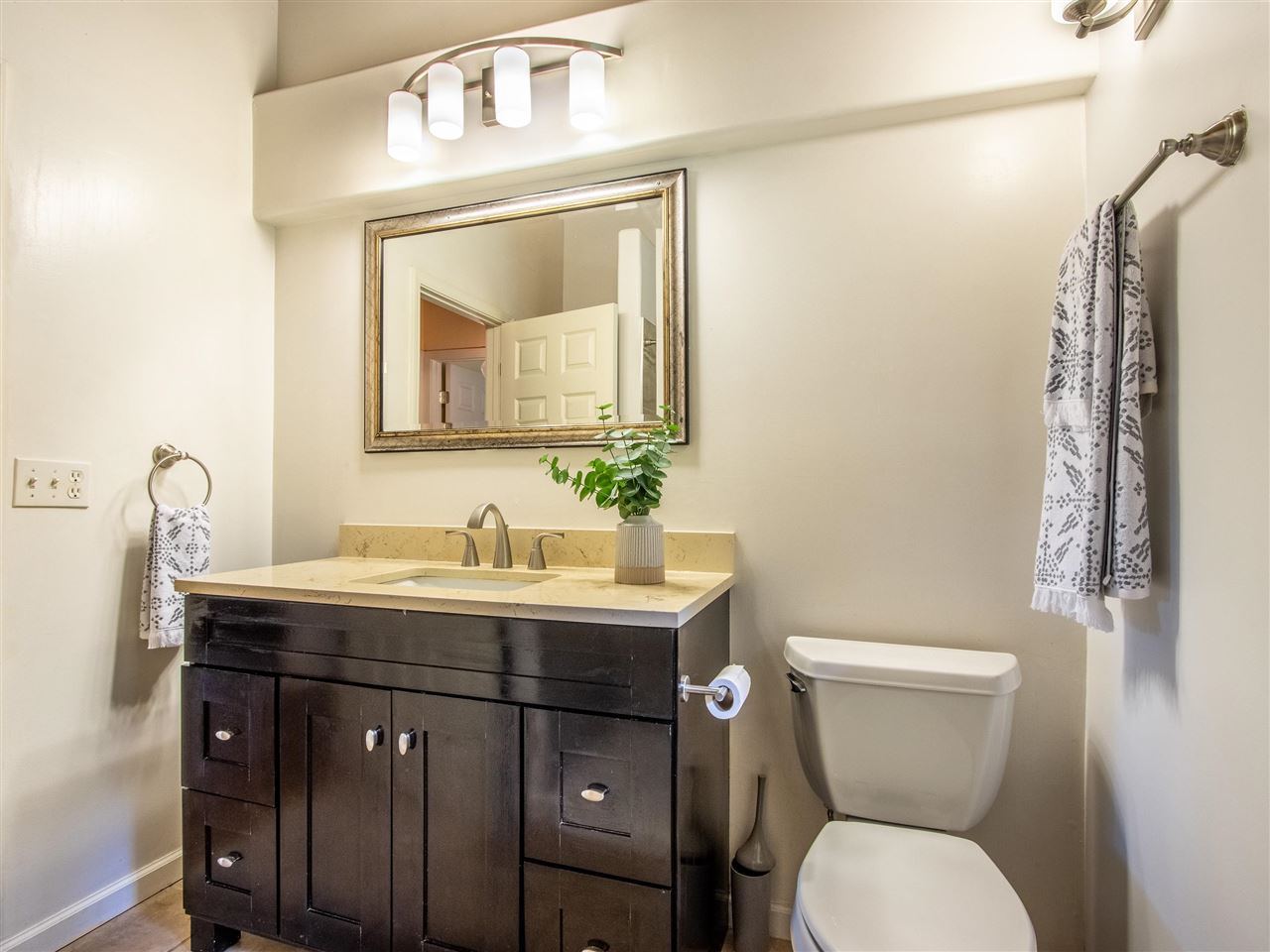 4508 Waha Place Haiku, HI 96708 - Photo 14 of 30 a bathroom with a toilet a sink and mirror