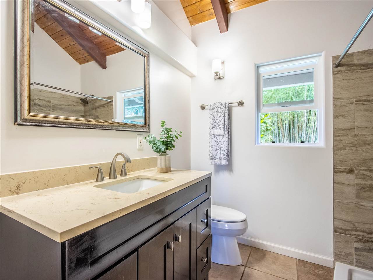 4508 Waha Place Haiku, HI 96708 - Photo 15 of 30 a bathroom with a sink a toilet and a mirror