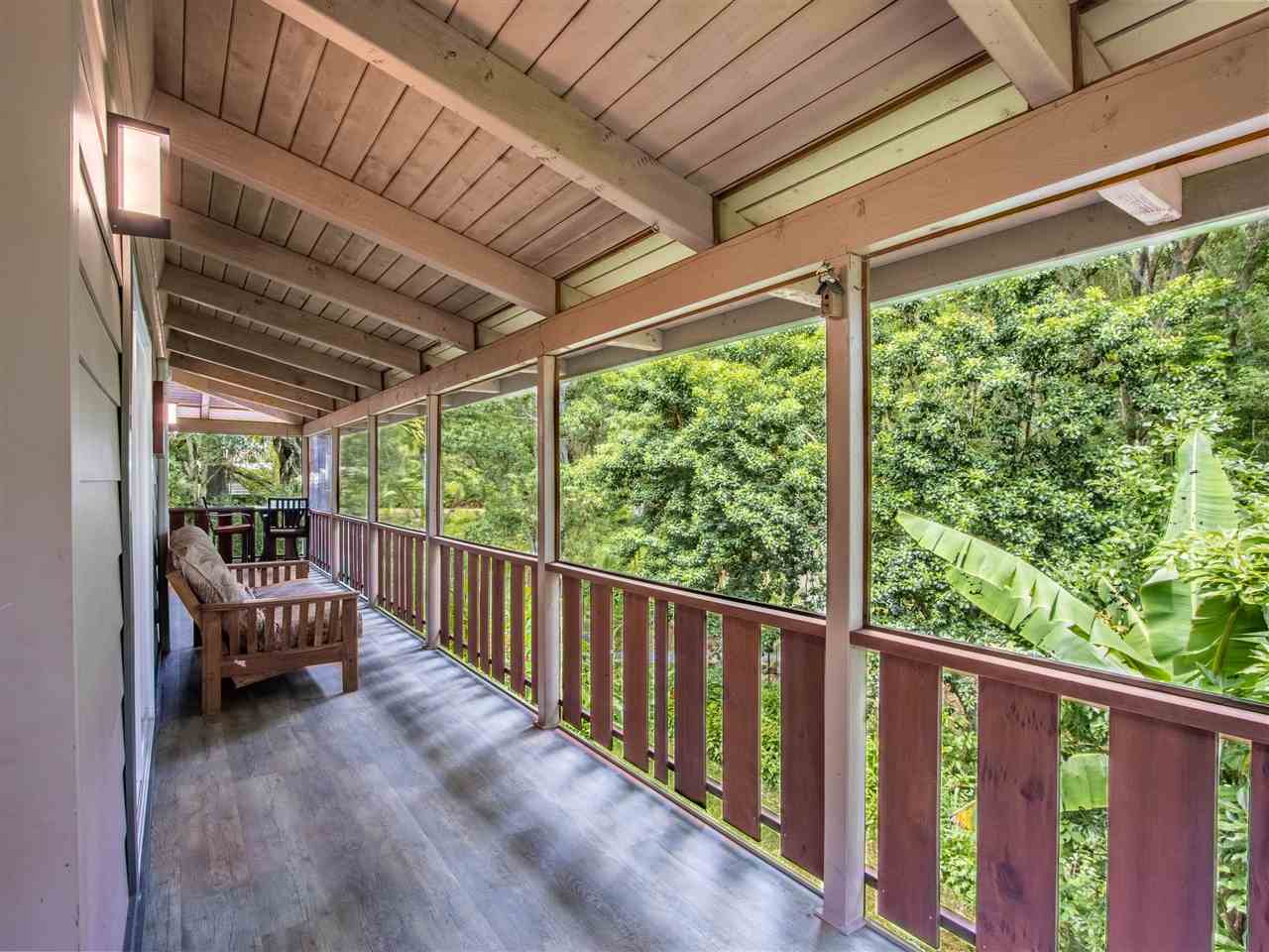 4508 Waha Place Haiku, HI 96708 - Photo 17 of 30 a view of porch with furniture and wooden fence