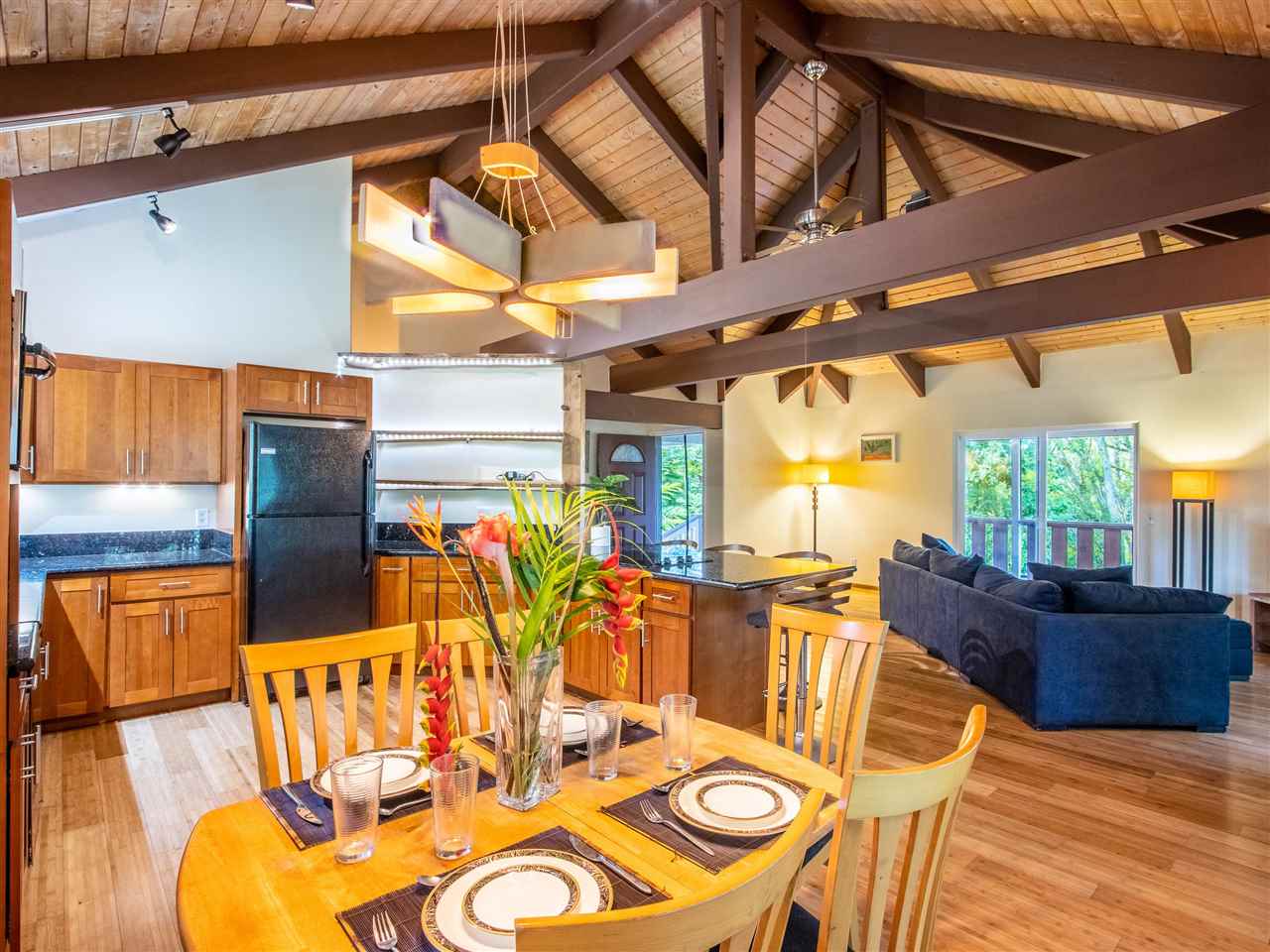 4508 Waha Place Haiku, HI 96708 - Photo 8 of 30 a view of a dining room with furniture a kitchen and chandelier